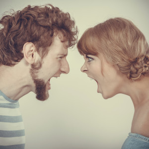 relationship difficulties. Angry woman and man yelling at each other. Face to face.