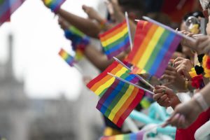 lgbtq rainbow flags being waved